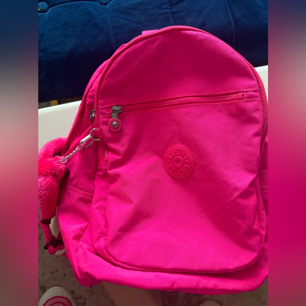 Hot pink Kipling back bag- new never used.